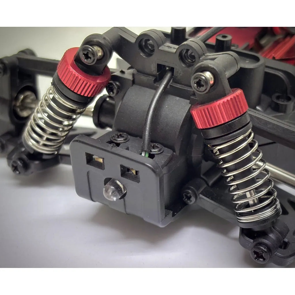 Absima Desert Runner 4WD Rot 10032 im Maßstab 1:20 Buggy RTR – Detailansicht Fahrwerk mit Federn und roten Dämpfern