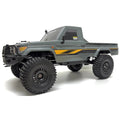 Absima Hilux Crawler CR4.4eco Grau 12050 im Maßstab 1:10 Crawler RTR – Seitenansicht mit großen Geländereifen und Stoßfänger