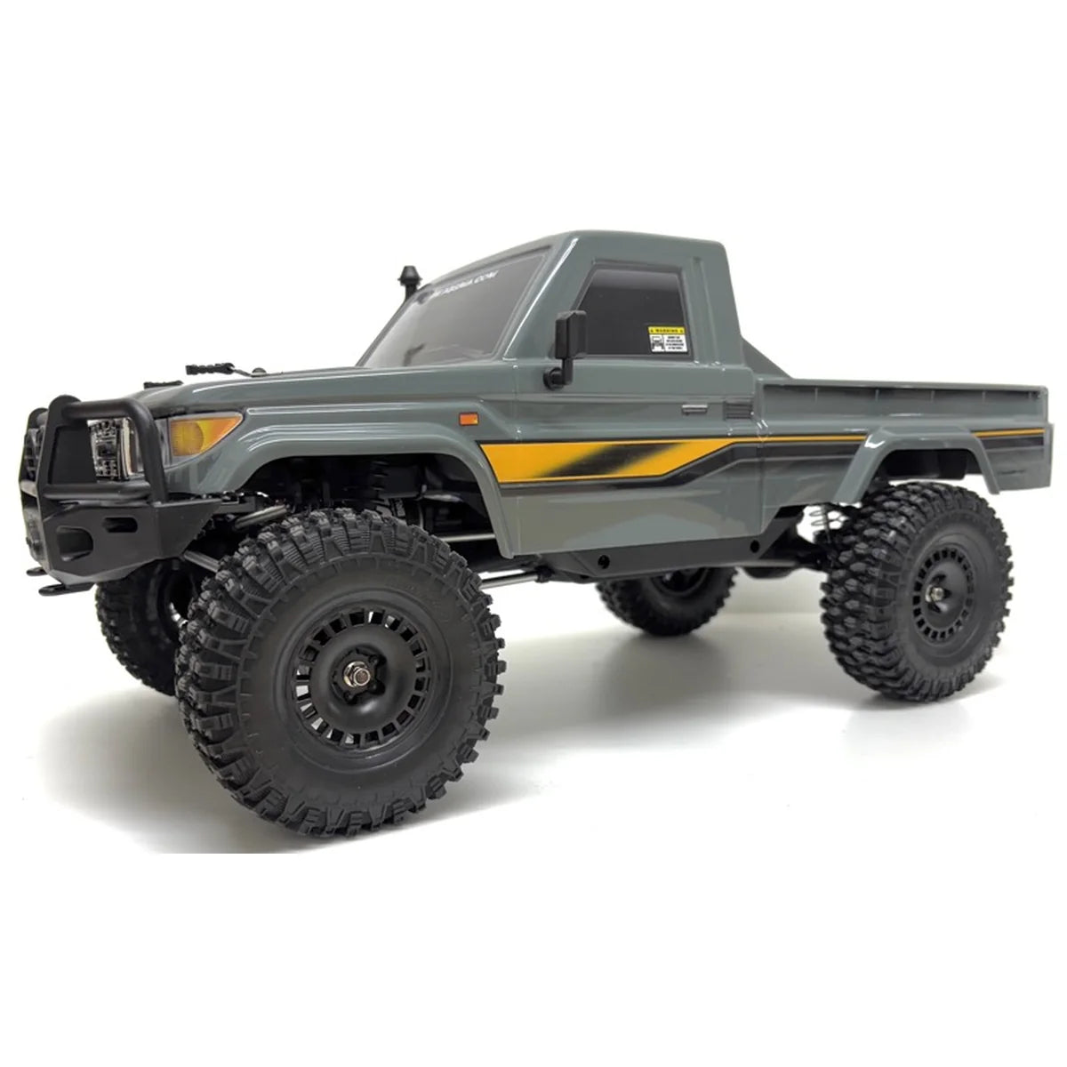 Absima Hilux Crawler CR4.4eco Grau 12050 im Maßstab 1:10 Crawler RTR – Seitenansicht mit großen Geländereifen und Stoßfänger