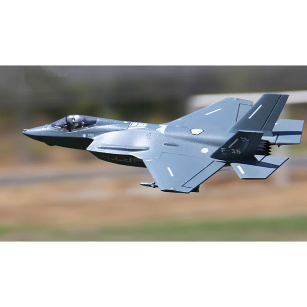 Amewi AMXFlight F-35 Jet EPO grau 24116 Flugzeug PNP – Seitenansicht mit eingeklappten Tragflächen im Flug