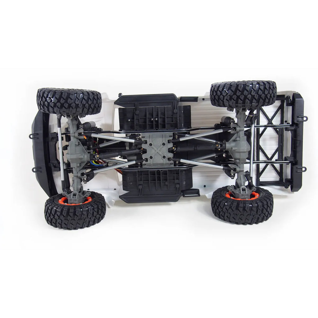 Amewi AMXRock RCX10B Scale Crawler Pick-up Grau 22433 im Maßstab 1:10 Crawler RTR – Draufsicht mit Chassis, Achsen und Reifen