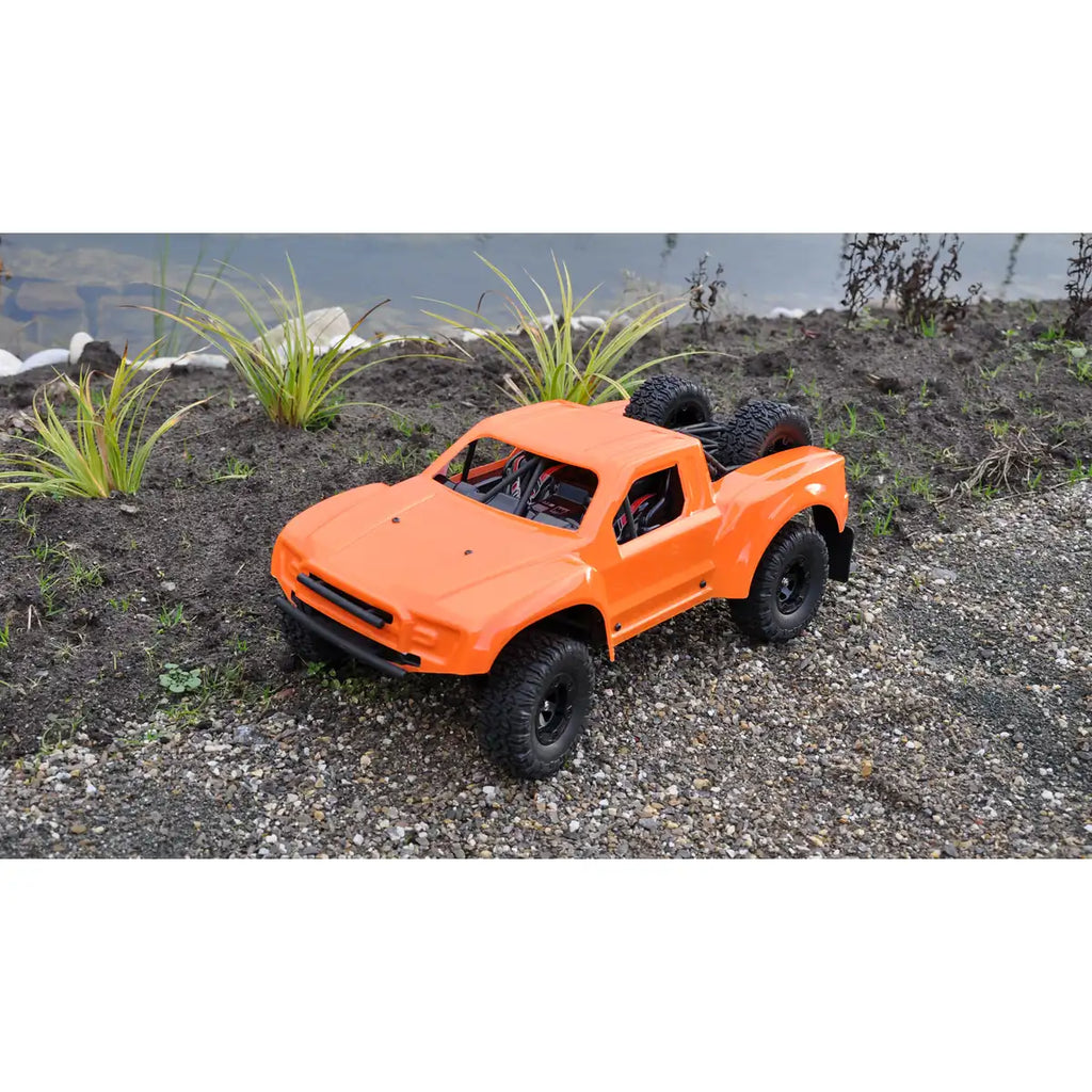 Amewi Short Course Truck SC12 brushed Orange 22429 im Maßstab 1:12 Offroad RTR – Seitenansicht